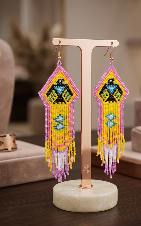 Beaded thunderbird earrings yellow / purple